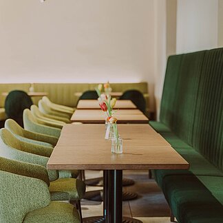 Tables in the restaurant of Burghotel Schlaining.
