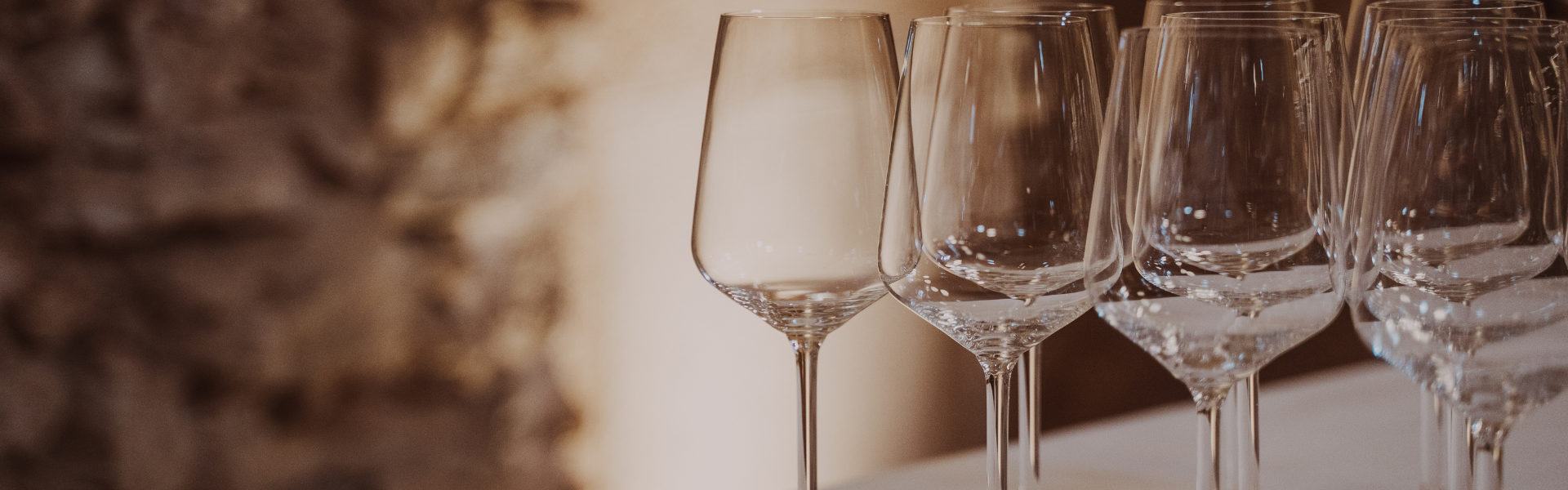 Table with wine glasses in the wine tasting room.