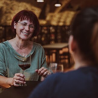 Ladies toast with wine at the Vinothek Burgenland wine tasting room.