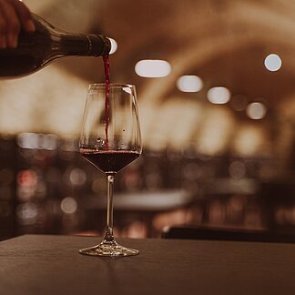 Pouring wine in the Vinothek Burgenland wine tasting room.