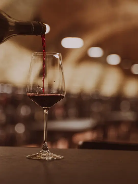 Wine glass with wine in the Weinkosterei Vinothek Burgenland.