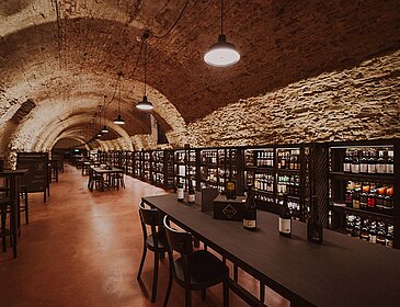 Tables and shelves in the Vinothek Burgenland wine tasting room.