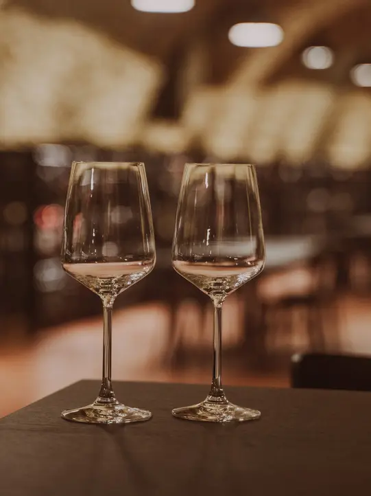 Empty wine glasses in the Weinkosterei Vinothek Burgenland.